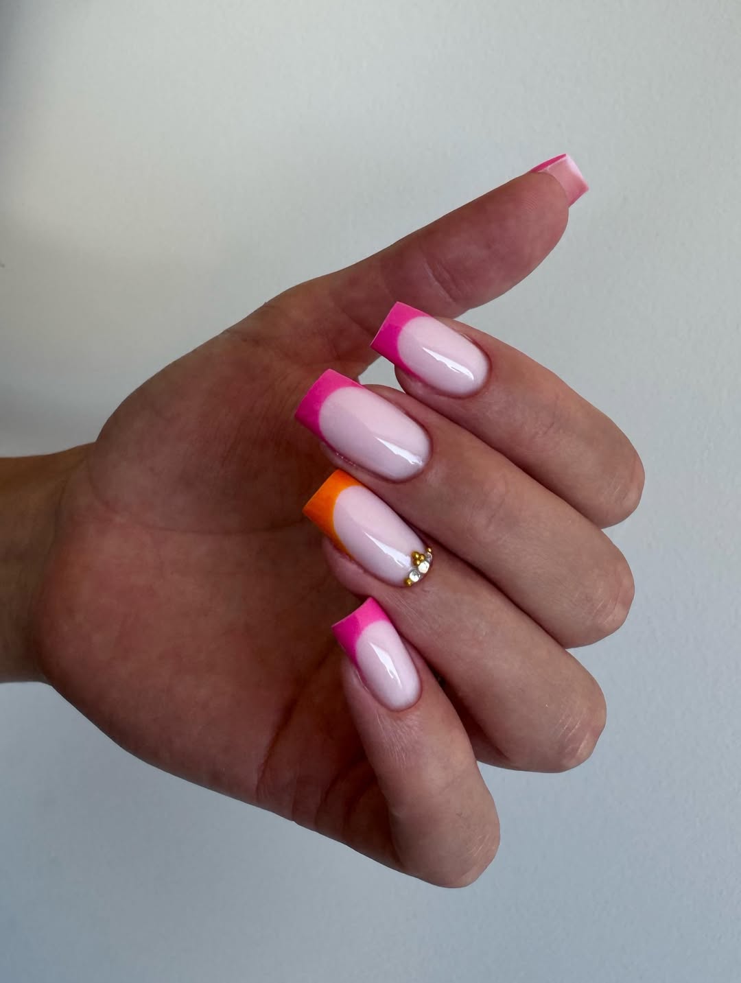 Vibrant Neon French Tip Square Nails with Rhinestone Accent
