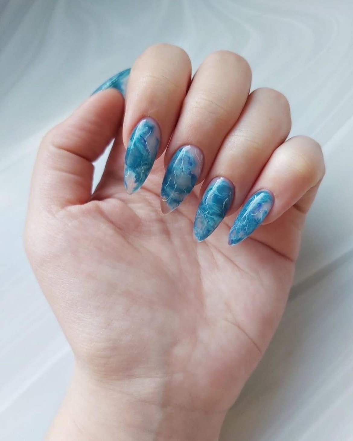 Abstract Blue Marble Stiletto Nails
