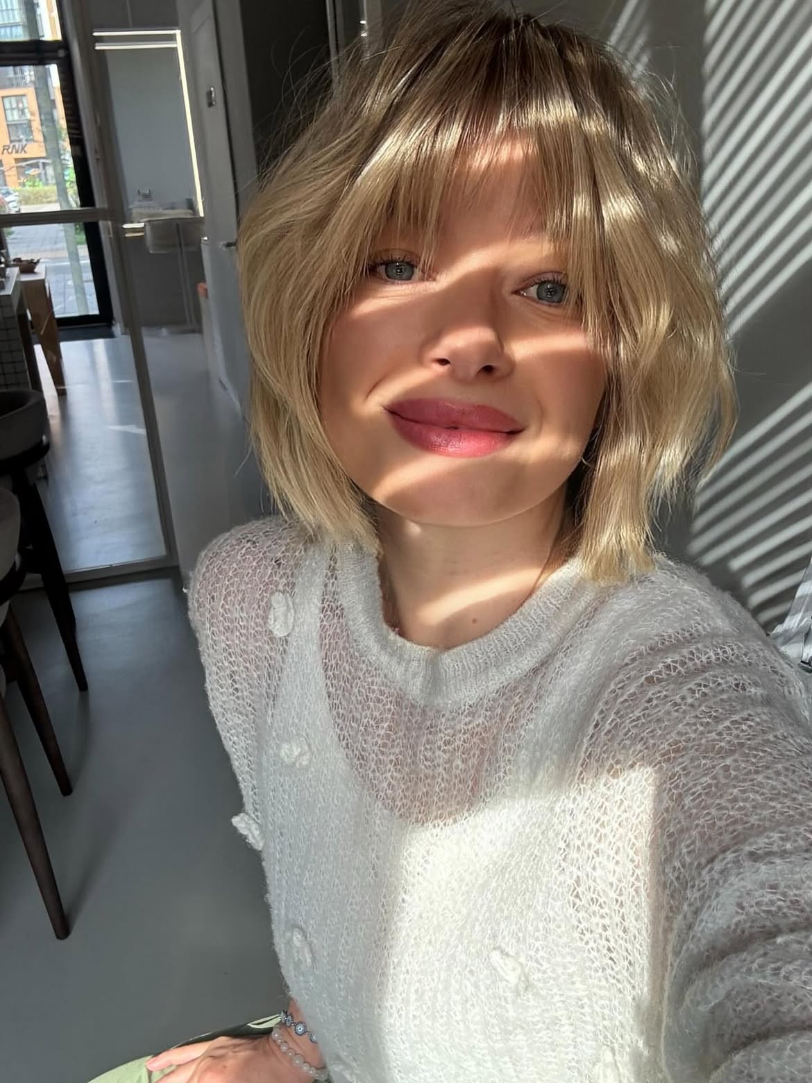 Beachy Blonde Lob With Textured Waves and Curtain Bangs