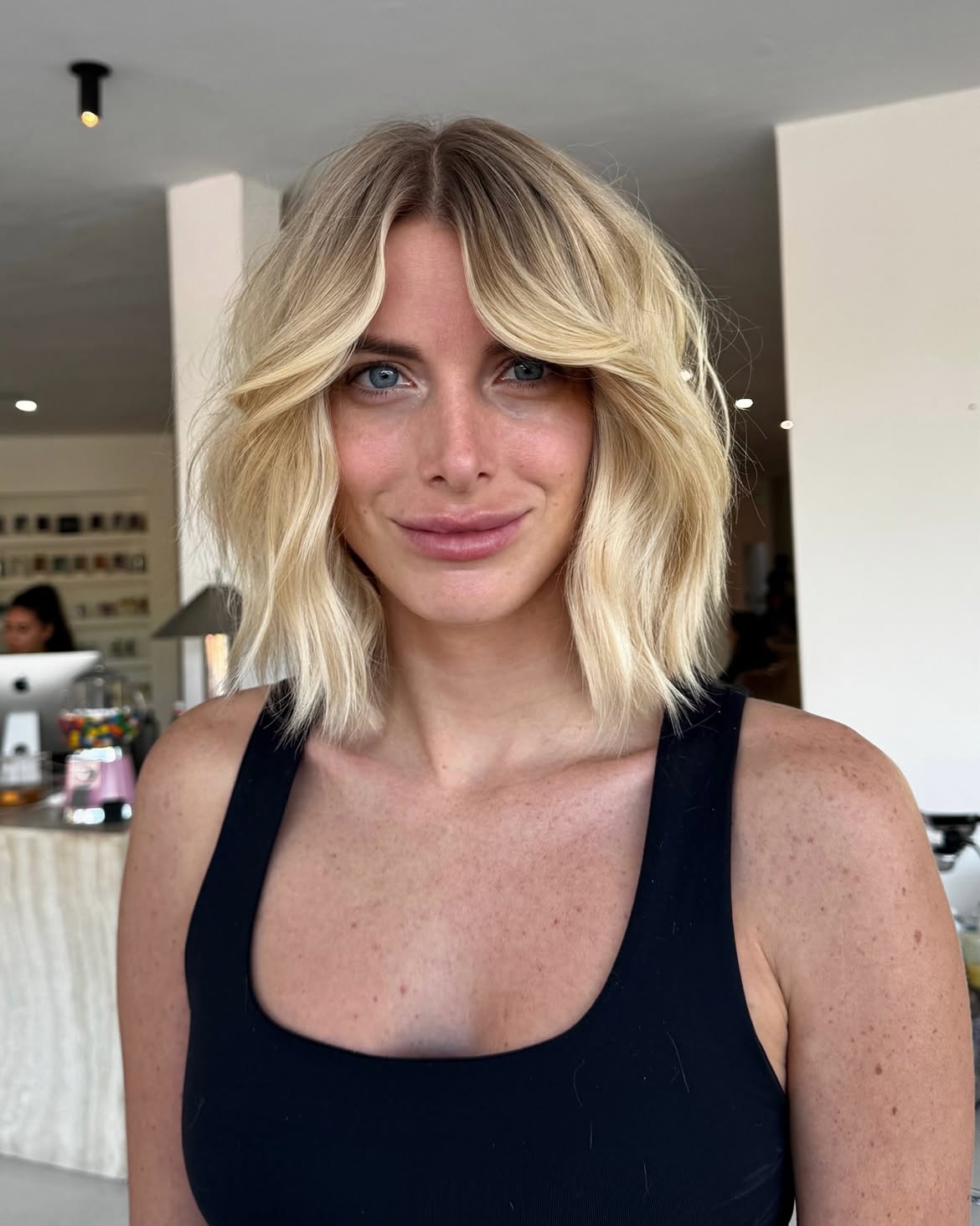 Beachy Blonde Waves With Face-Framing Curtain Bangs