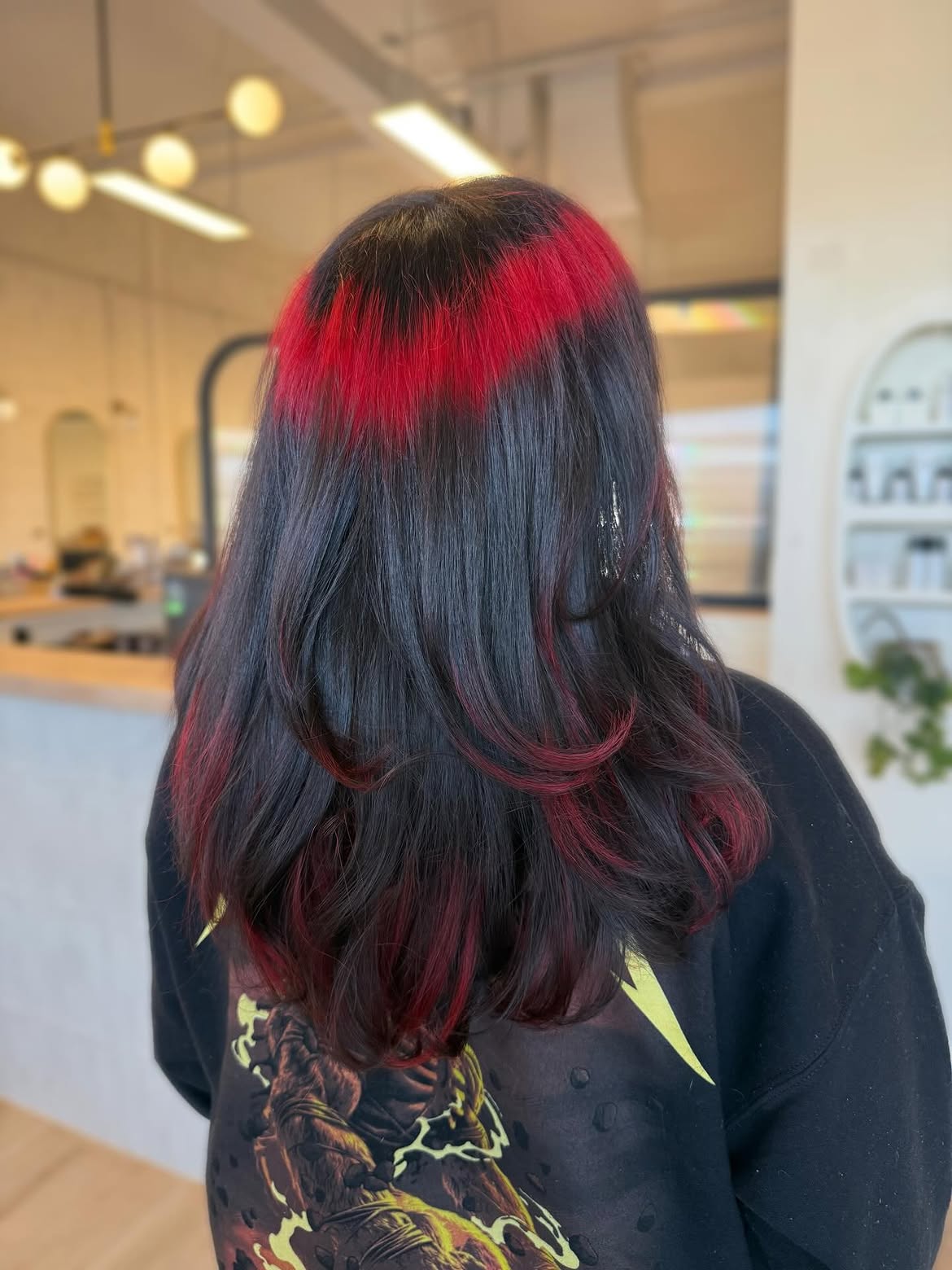 Bold Red Streak Highlights On Dark Hair