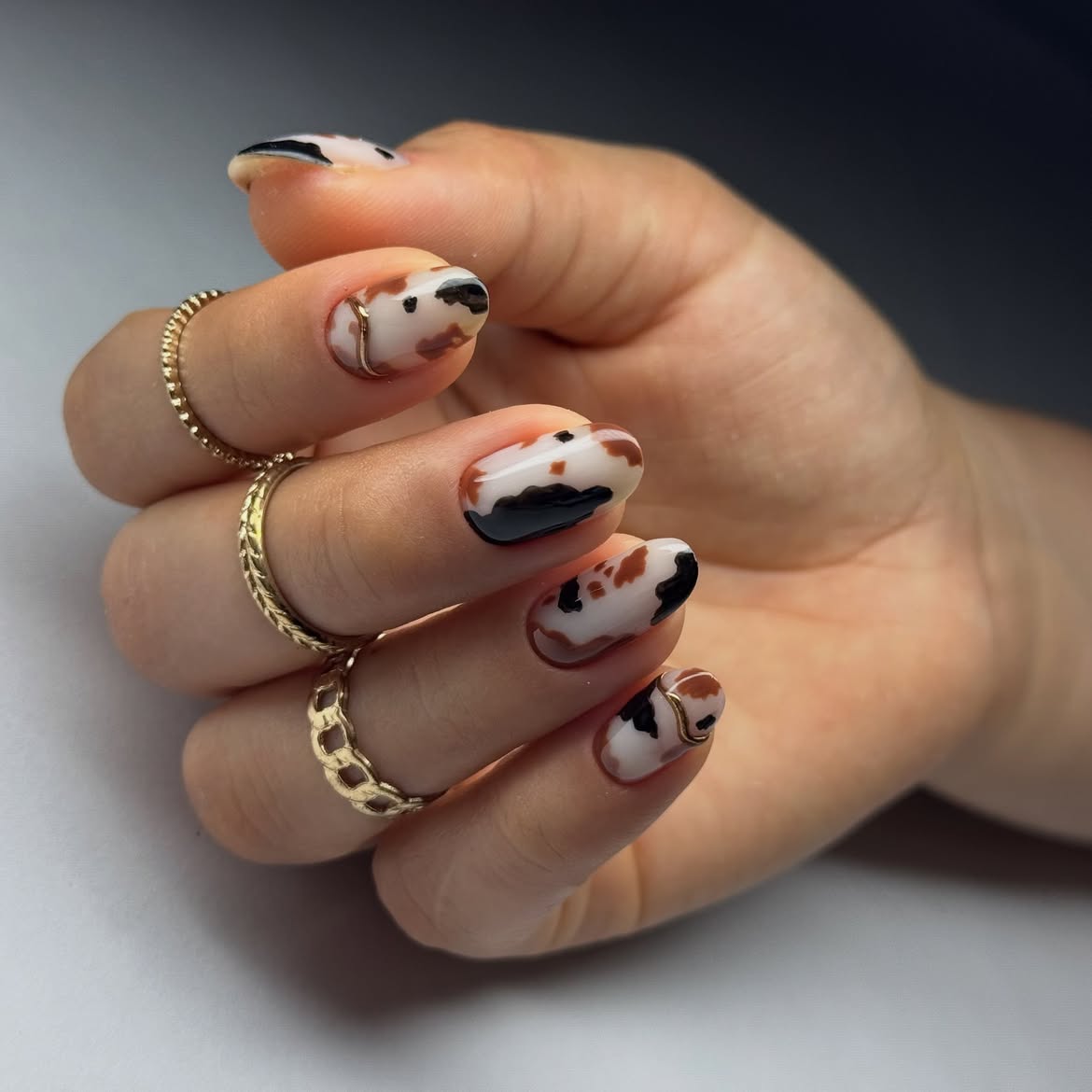 Brown and Black Cow Print Oval Nails