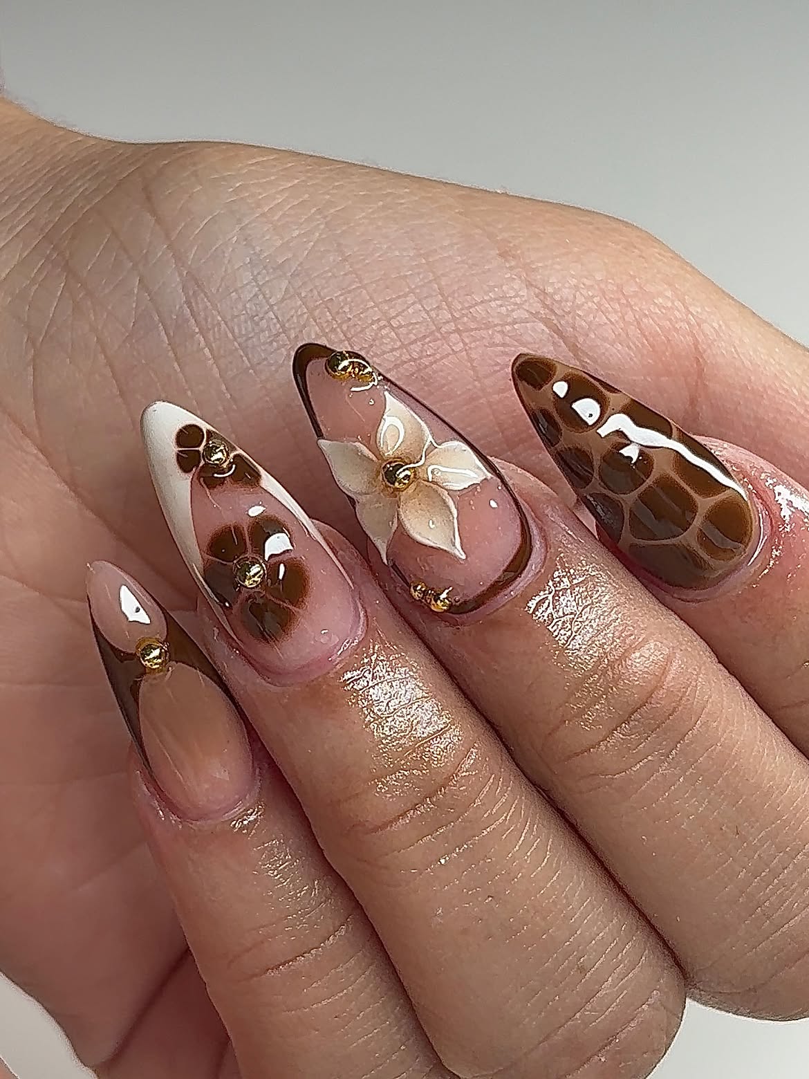 Brown Floral Stiletto Acrylic Nails with Gold Accents