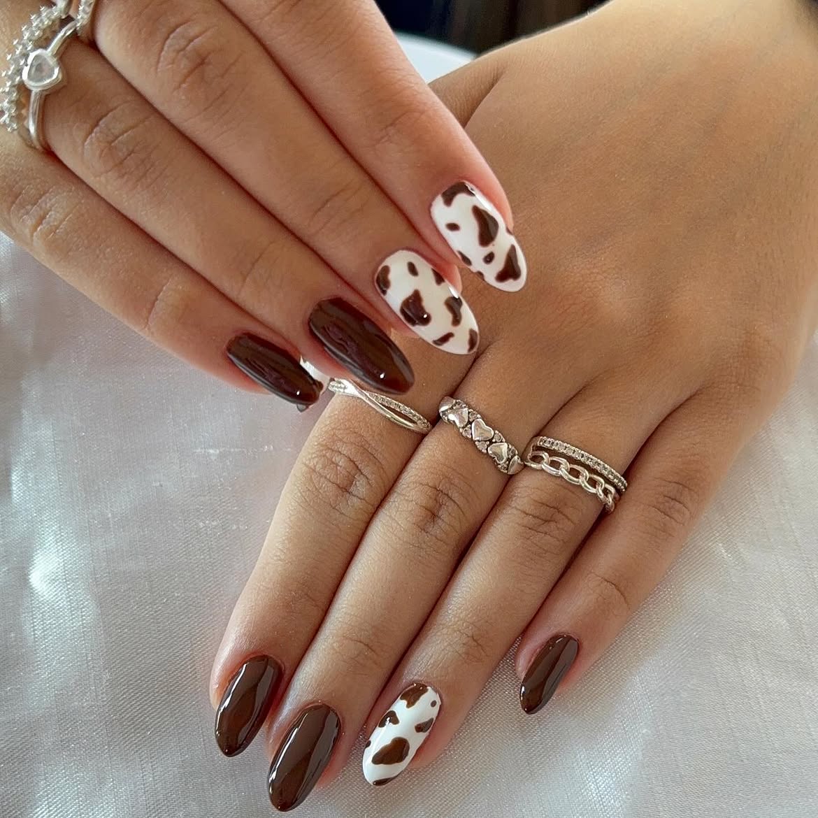 Chic Chocolate Cow Print Almond Nails