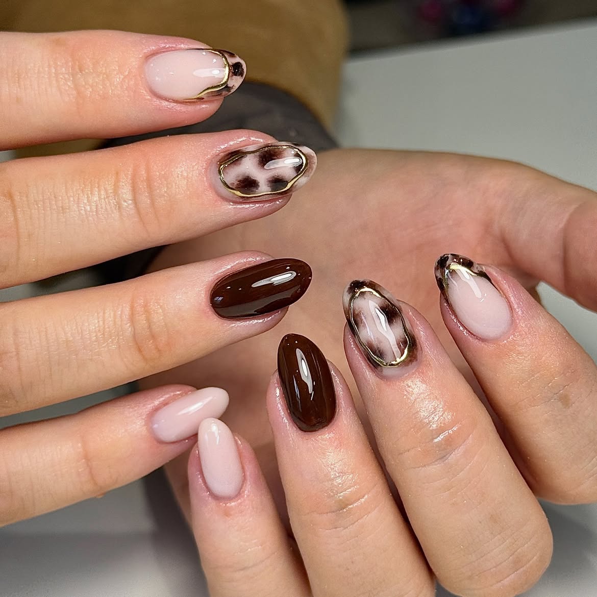 Chic Leopard Print and Chocolate Almond Nails