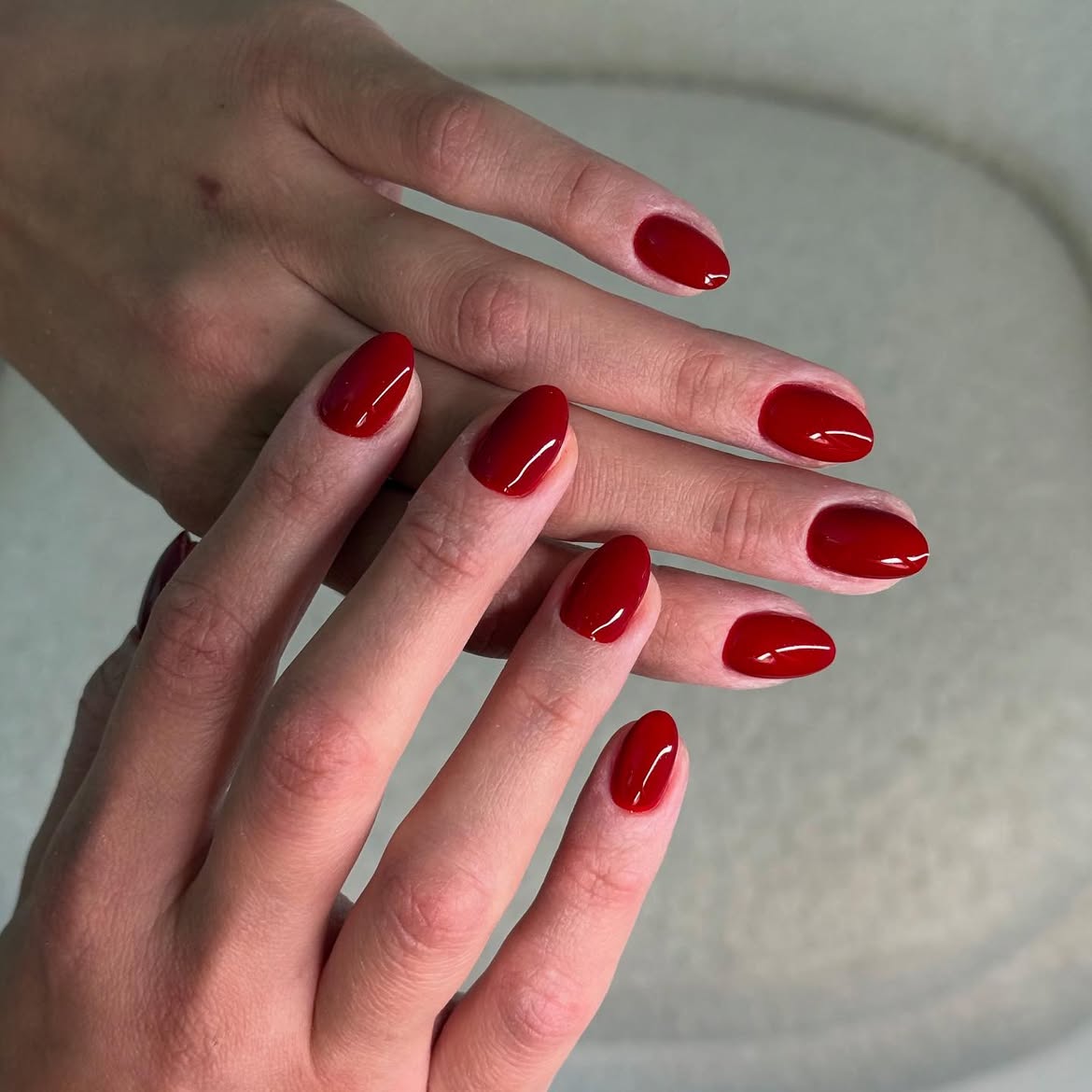 Classic glossy deep red almond nails