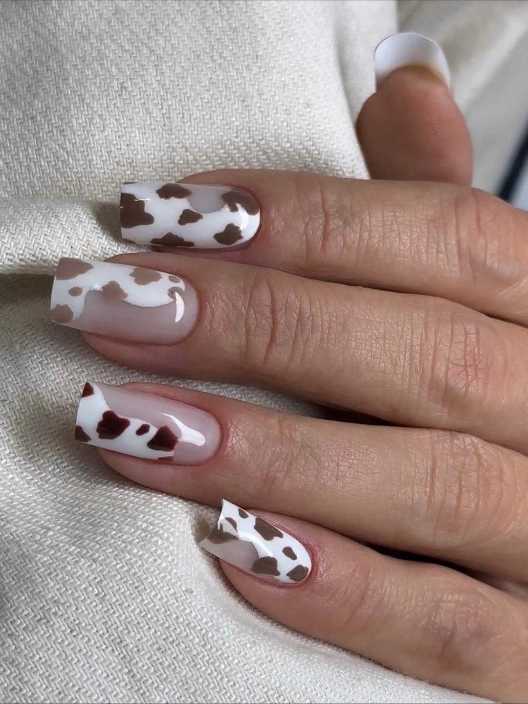 Cow Print French Tip Almond Nails