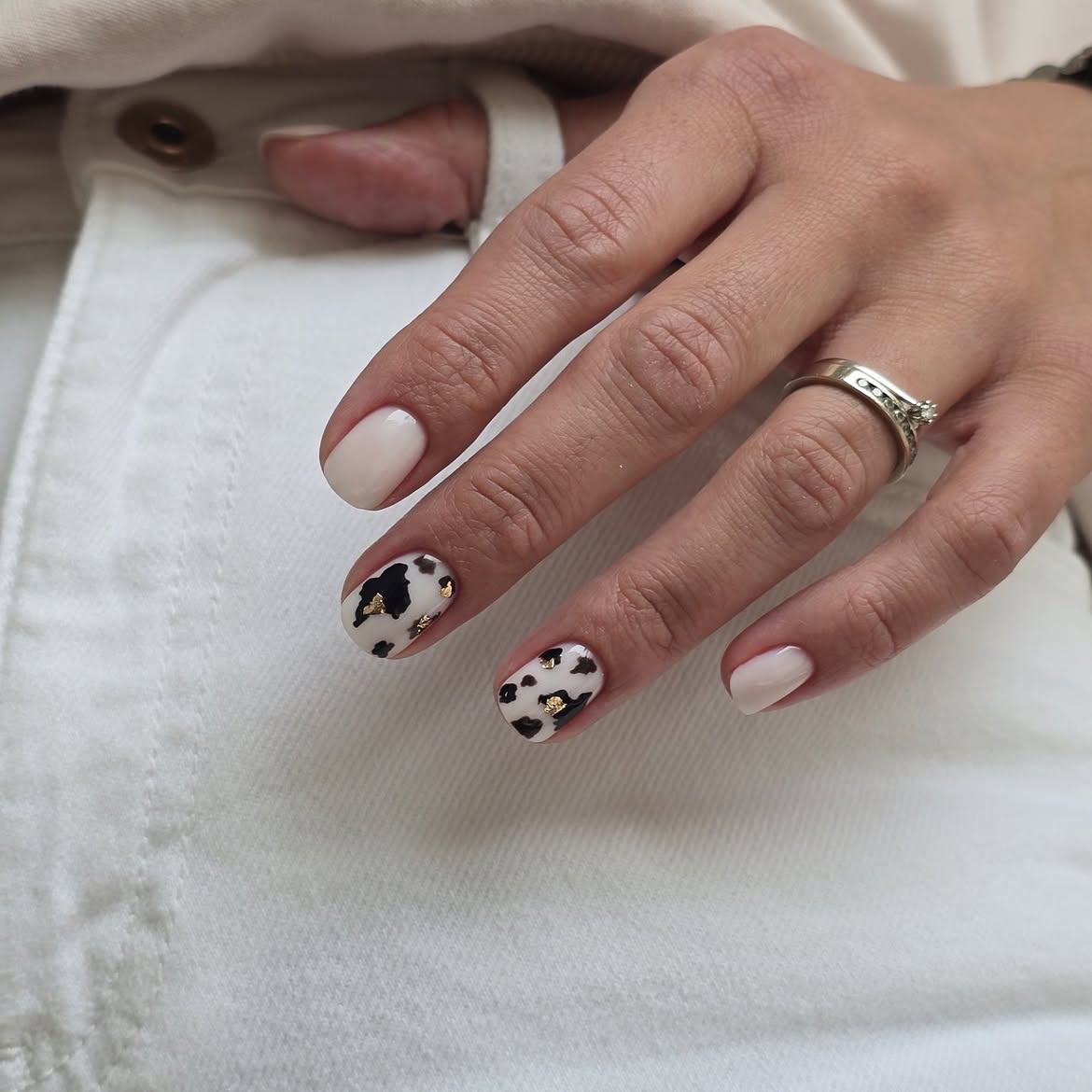 Cow Print with Gold Foil Almond Nails