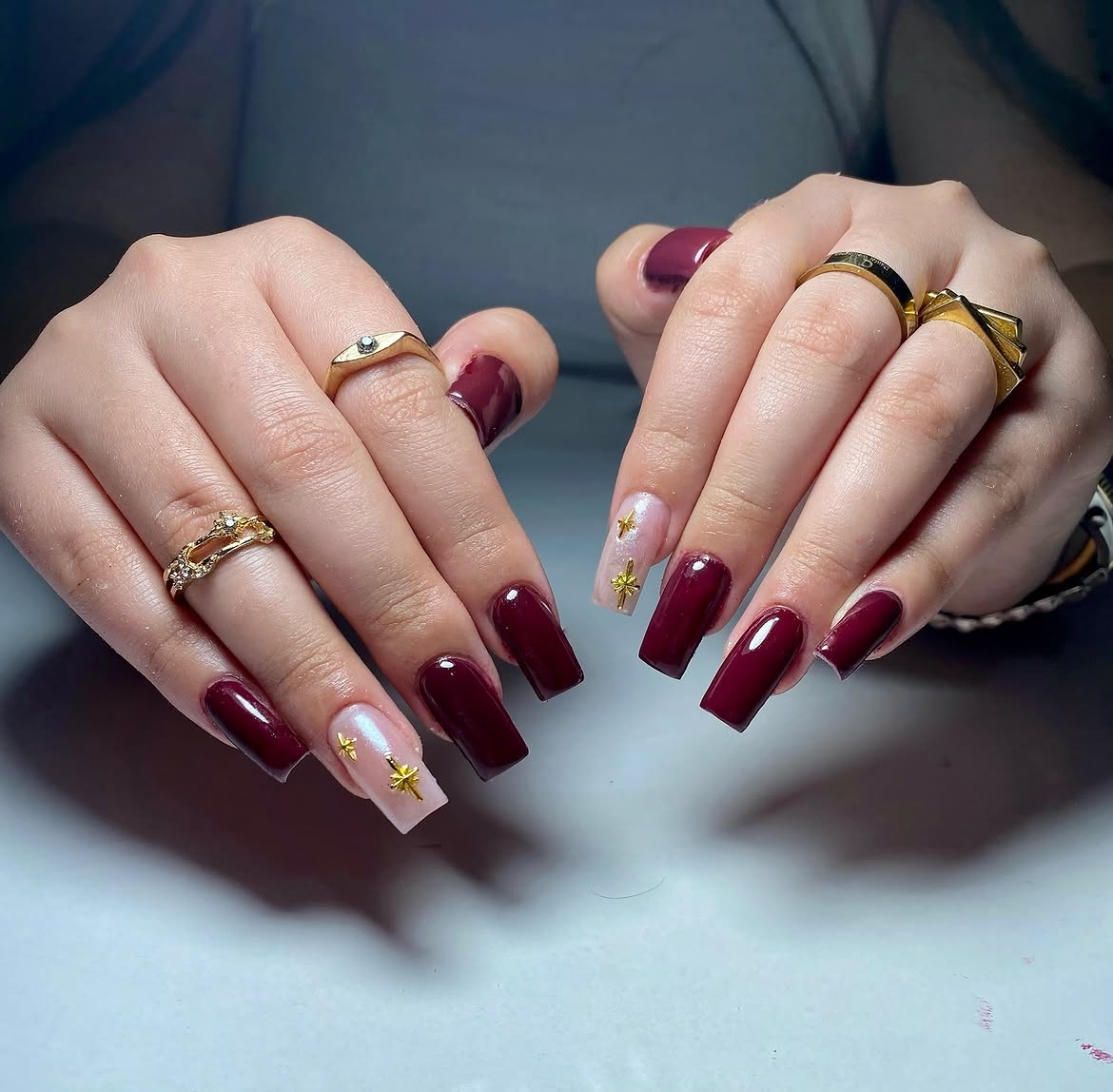 Deep Burgundy Glossy Coffin Nails with Star Accents