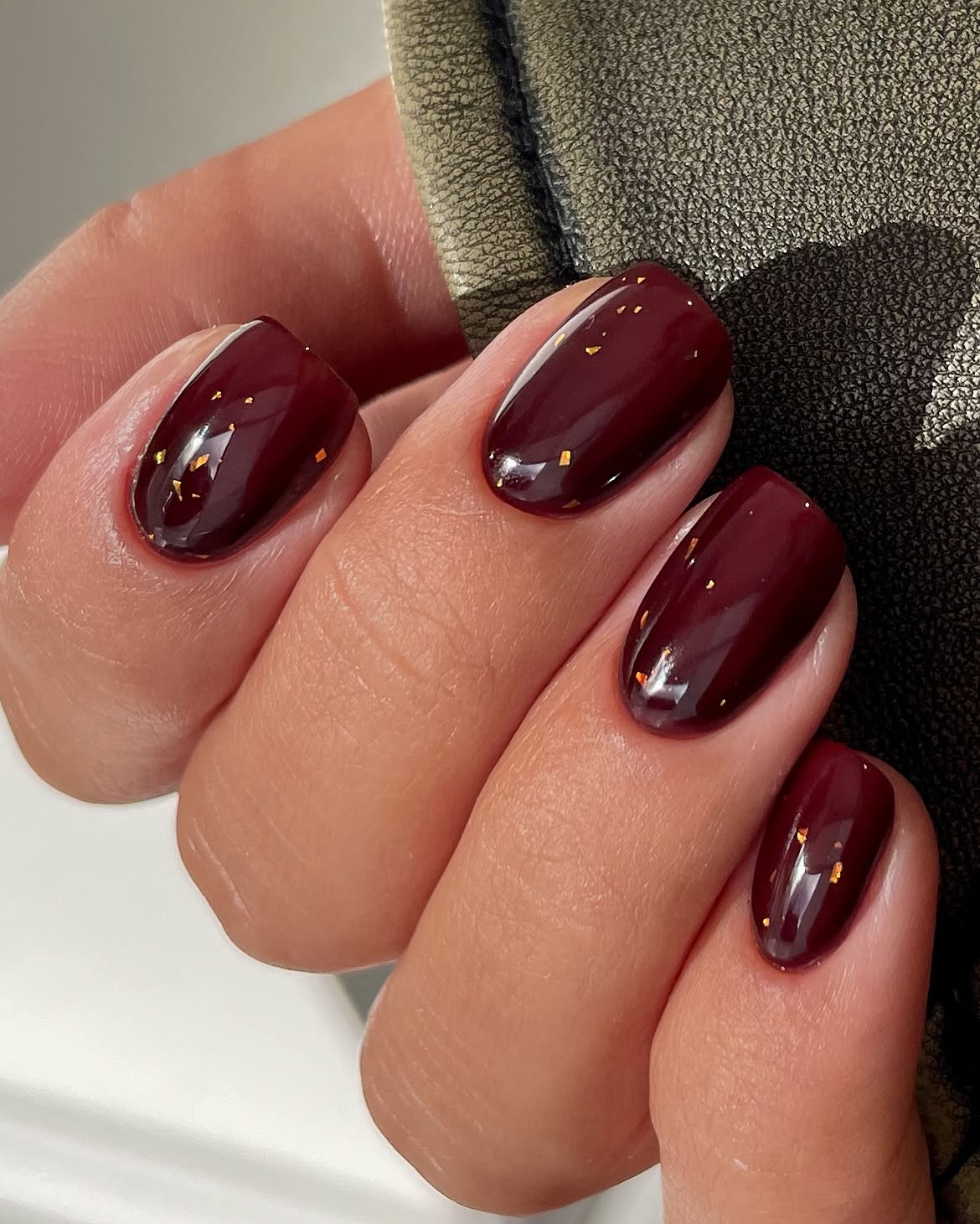 Deep Burgundy Glossy Nails with Gold Flakes