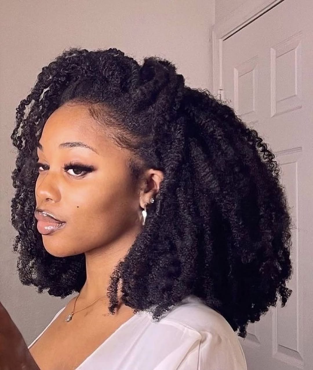 Defined Coils With Half-Up Top Knot