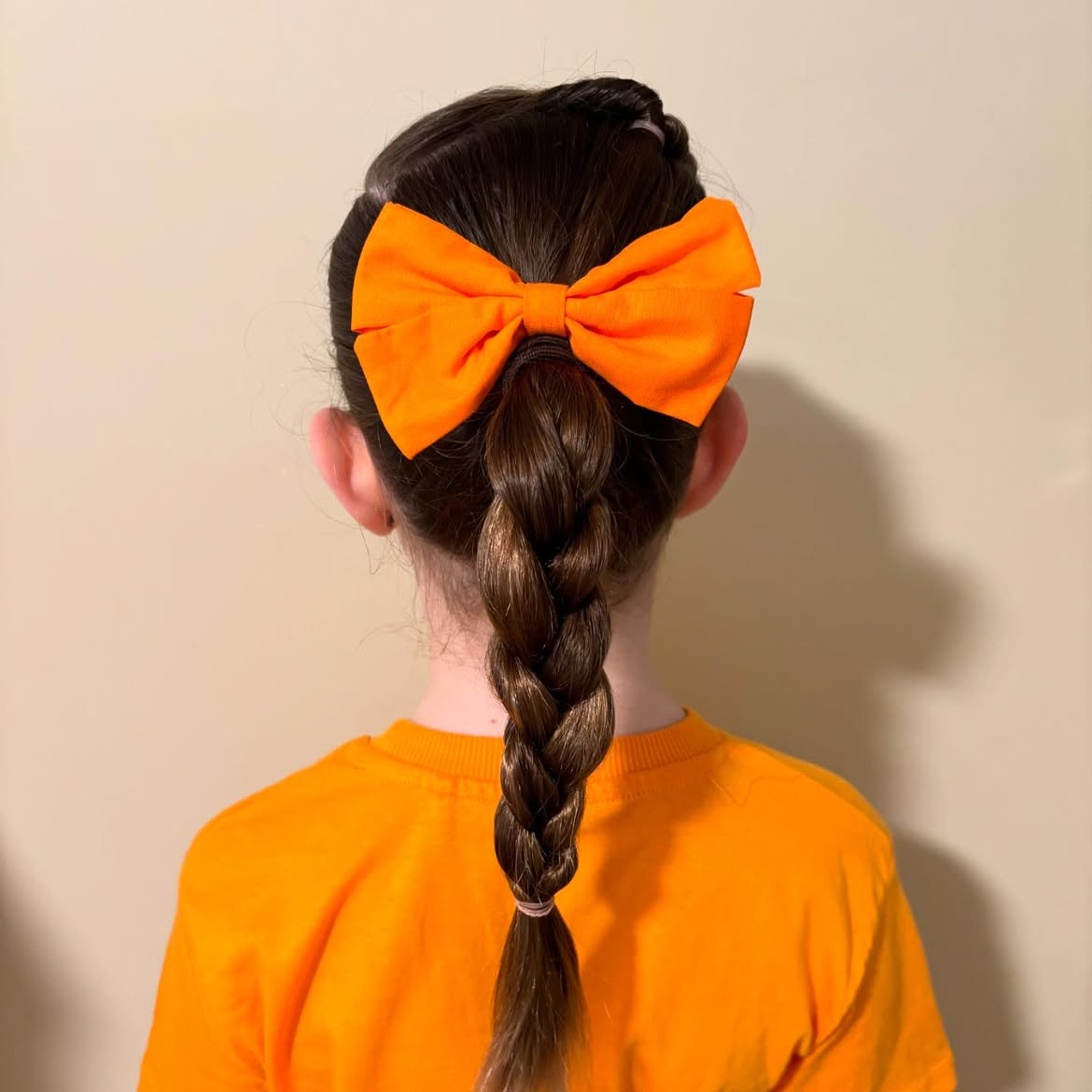 Double Dutch Braids With Orange Bow