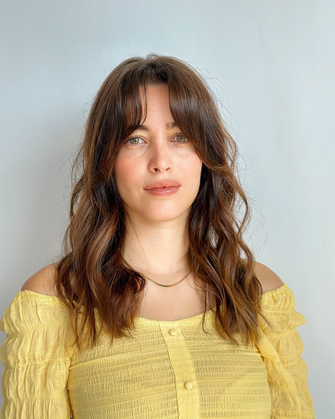 Effortless Chocolate Brown Waves With Face-Framing Bangs