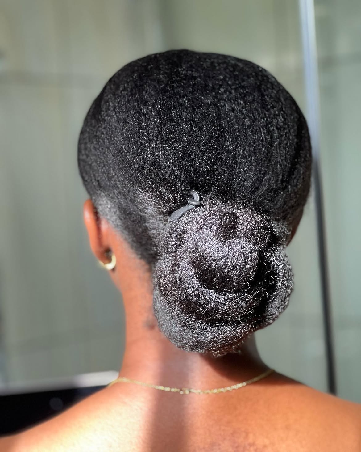 Elegant Low Bun for Coily Hair