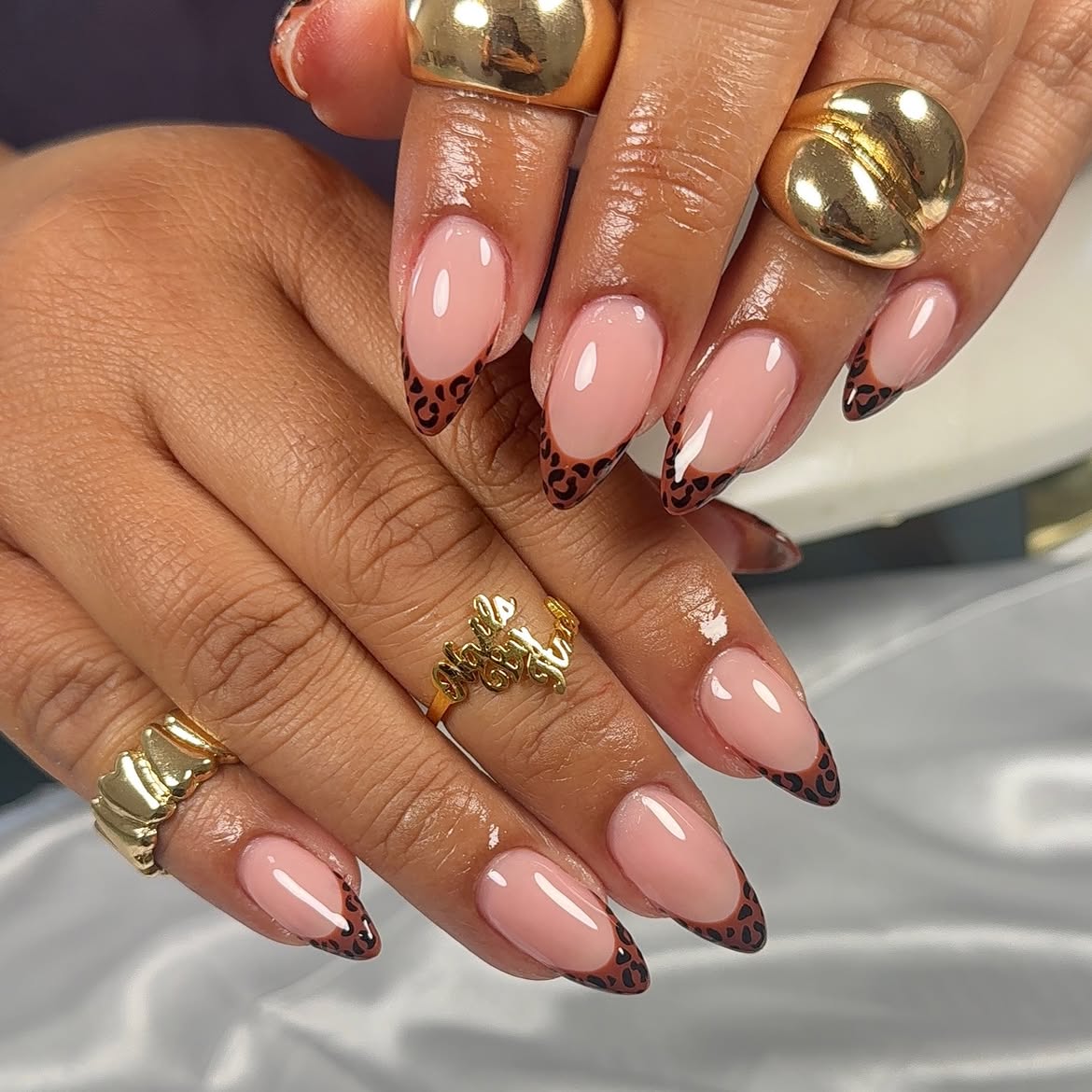 French Tip Almond Nails with Brown Cheetah Accent