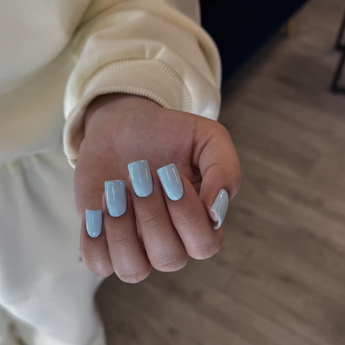 Glossy Baby Blue Square Nails With Pearl Accent