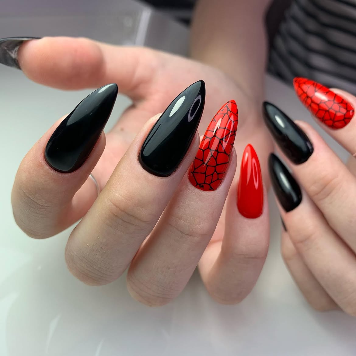 Glossy Black and Red Spiderweb Stiletto Nails