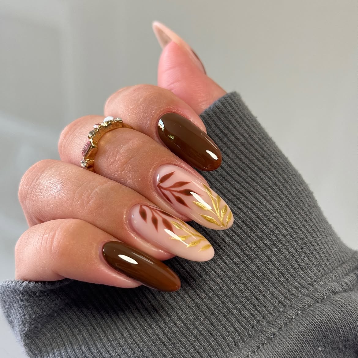 Glossy Chocolate Brown & Gold Leaf Almond Nails