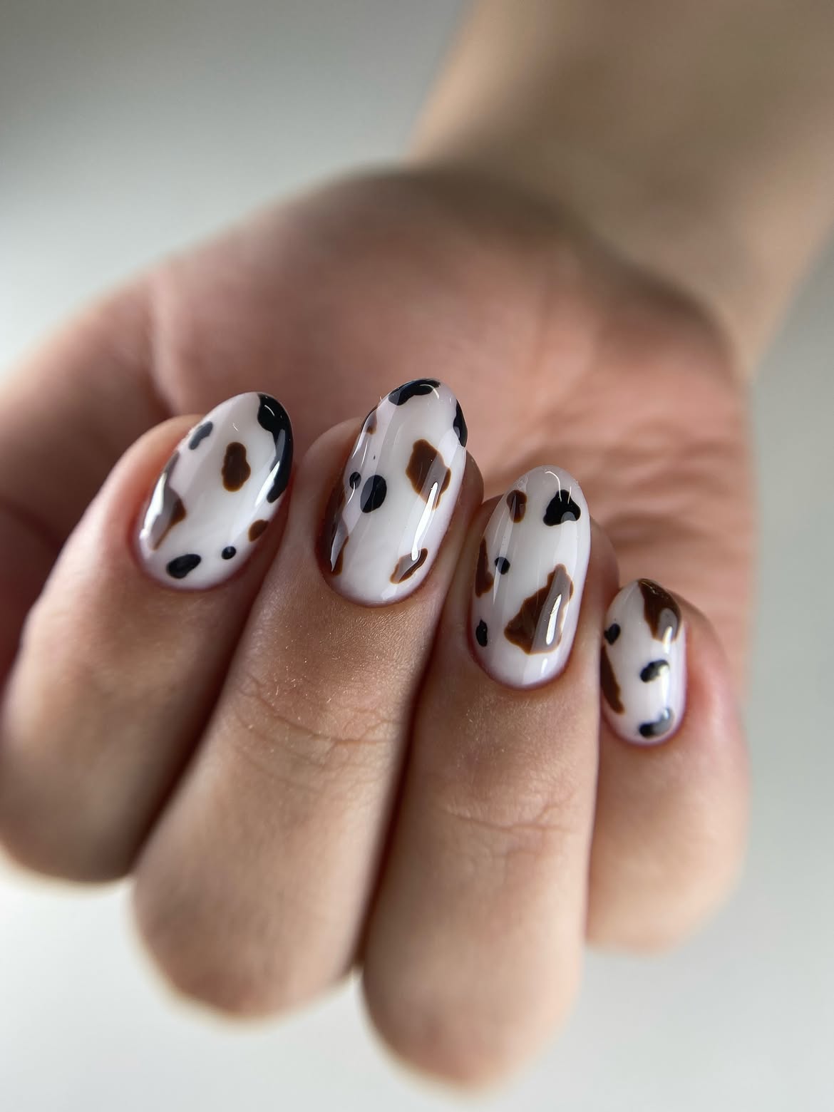 Glossy Cow Print Medium Oval Nails