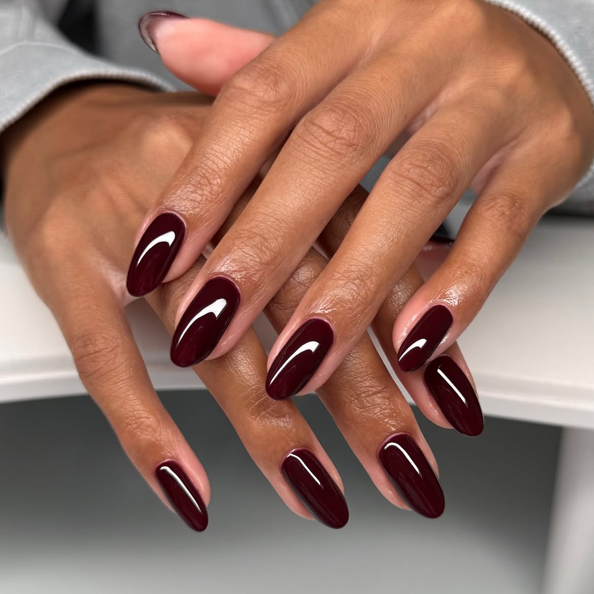 Glossy Deep Burgundy Almond Nails