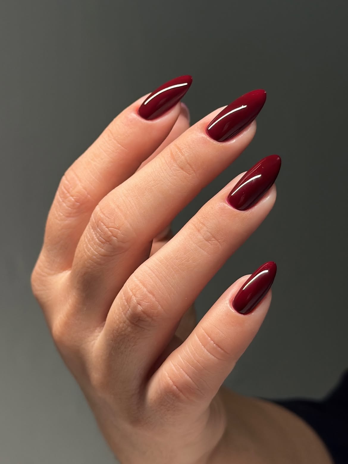 Glossy Deep Burgundy Almond Nails