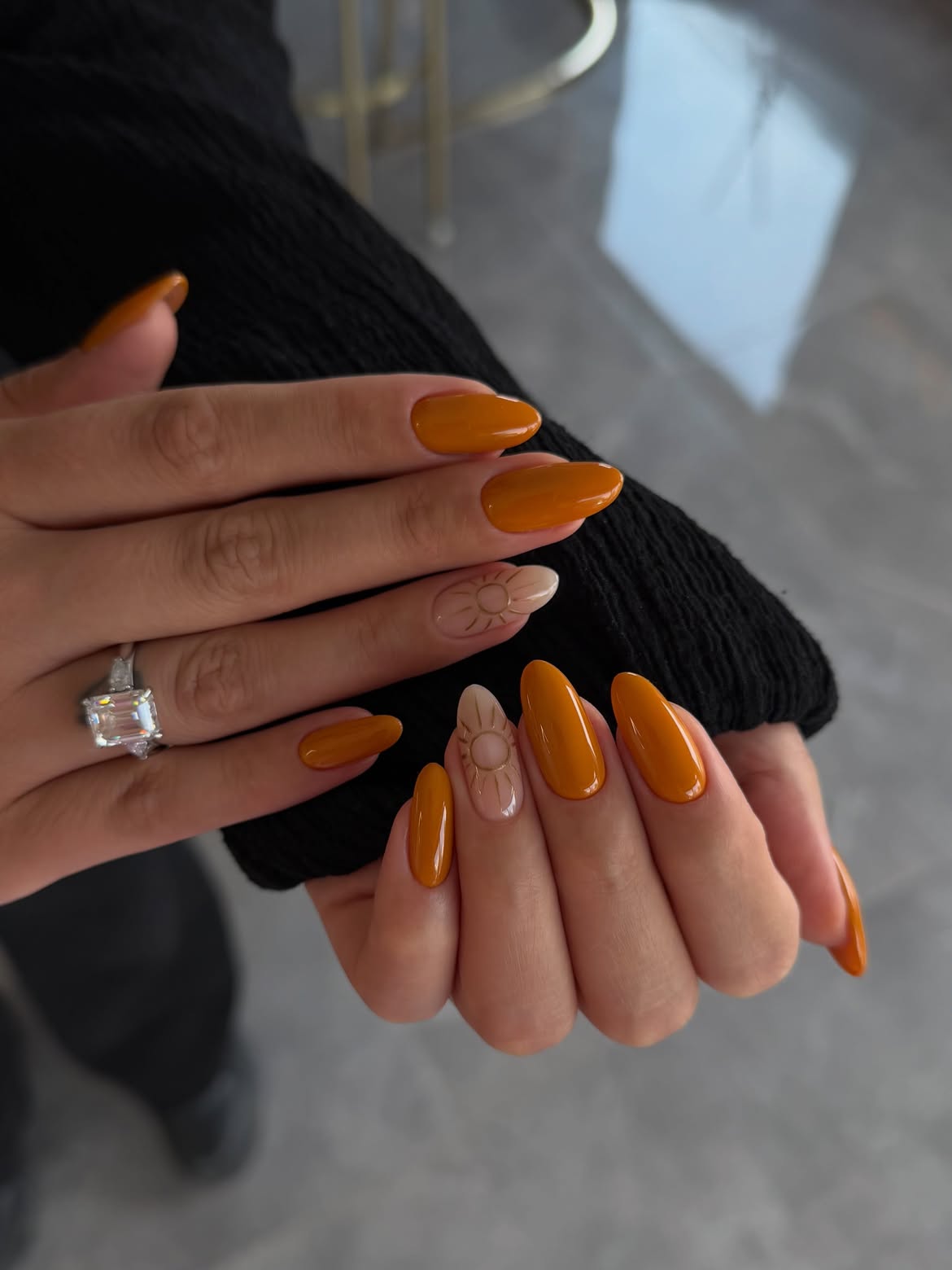 Golden Amber Almond Nails with Sunburst Art
