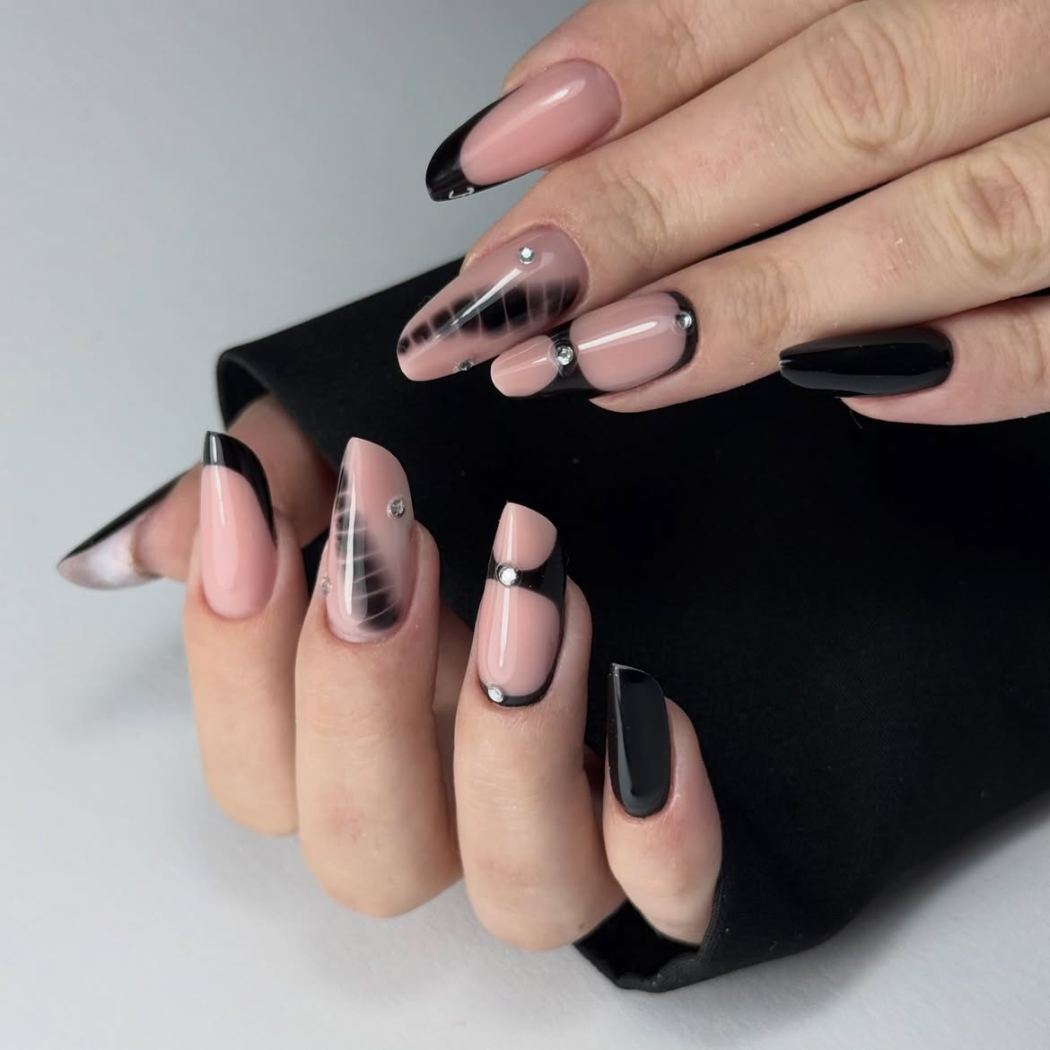 Gothic Black French Tip Almond Nails with Rhinestones