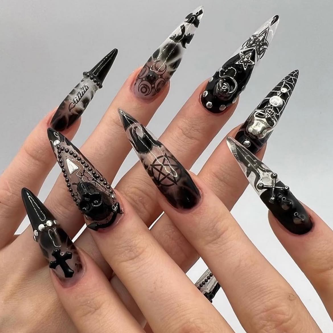 Gothic Stiletto Nails With Black Charm Accents