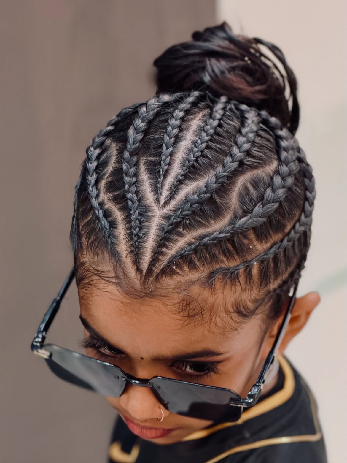 Intricate Cornrow Braids Into Top Knot