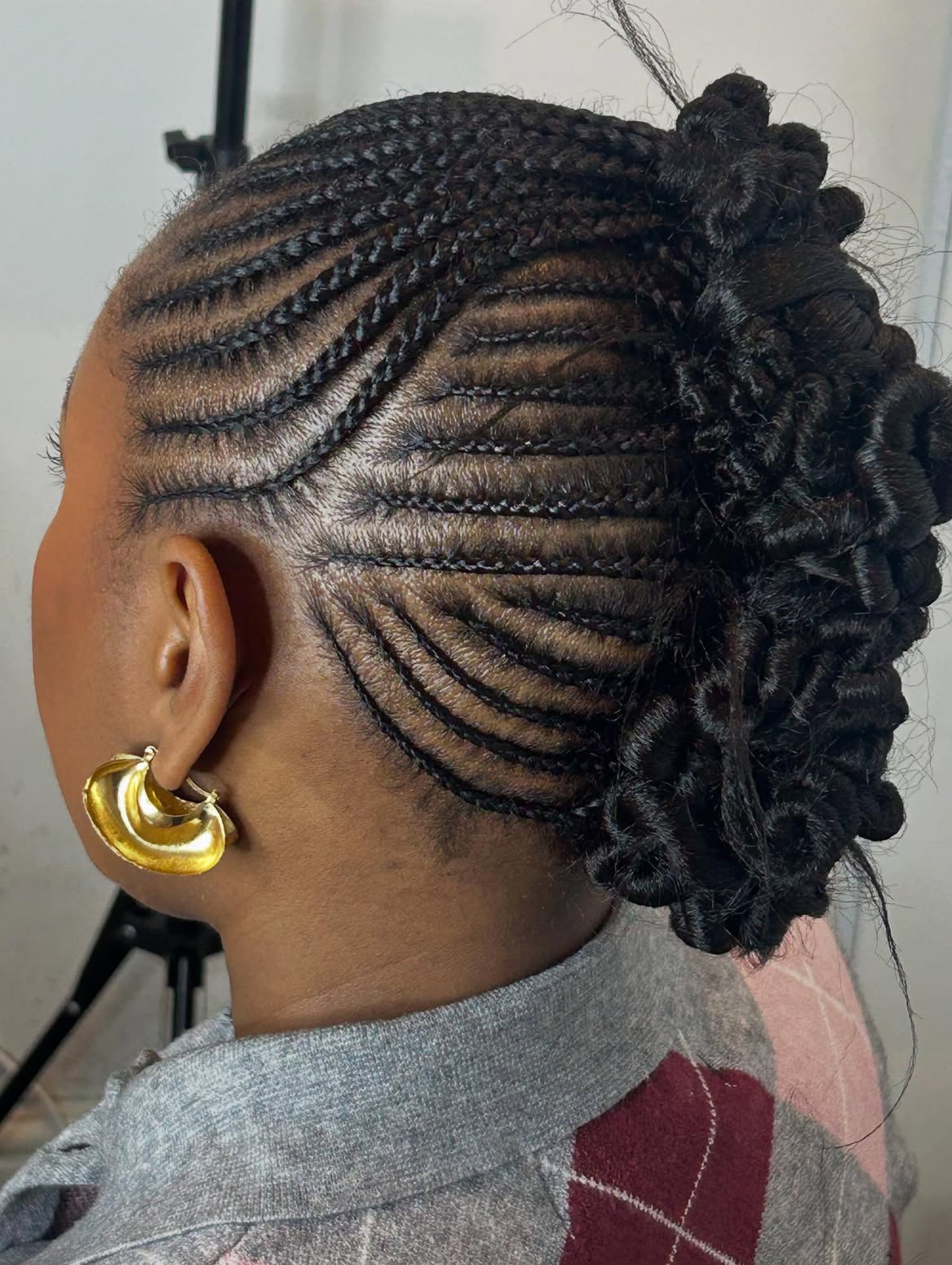 Intricate Cornrow Updo With Curly Tendrils