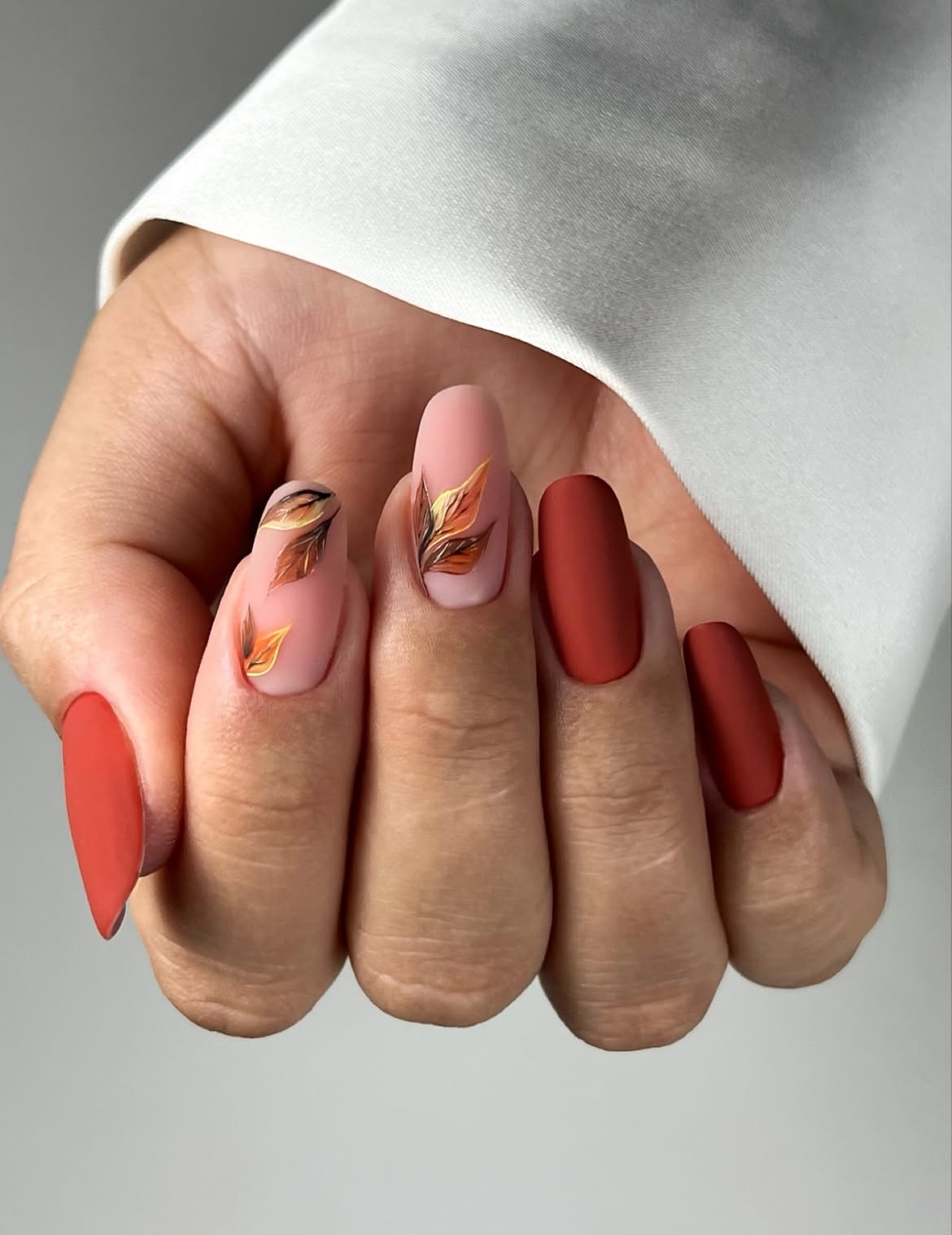 Matte Rust And Pink Fall Leaf Almond Nails