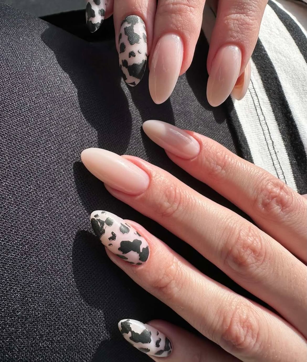 Milky Nude & Cow Print Almond Nails