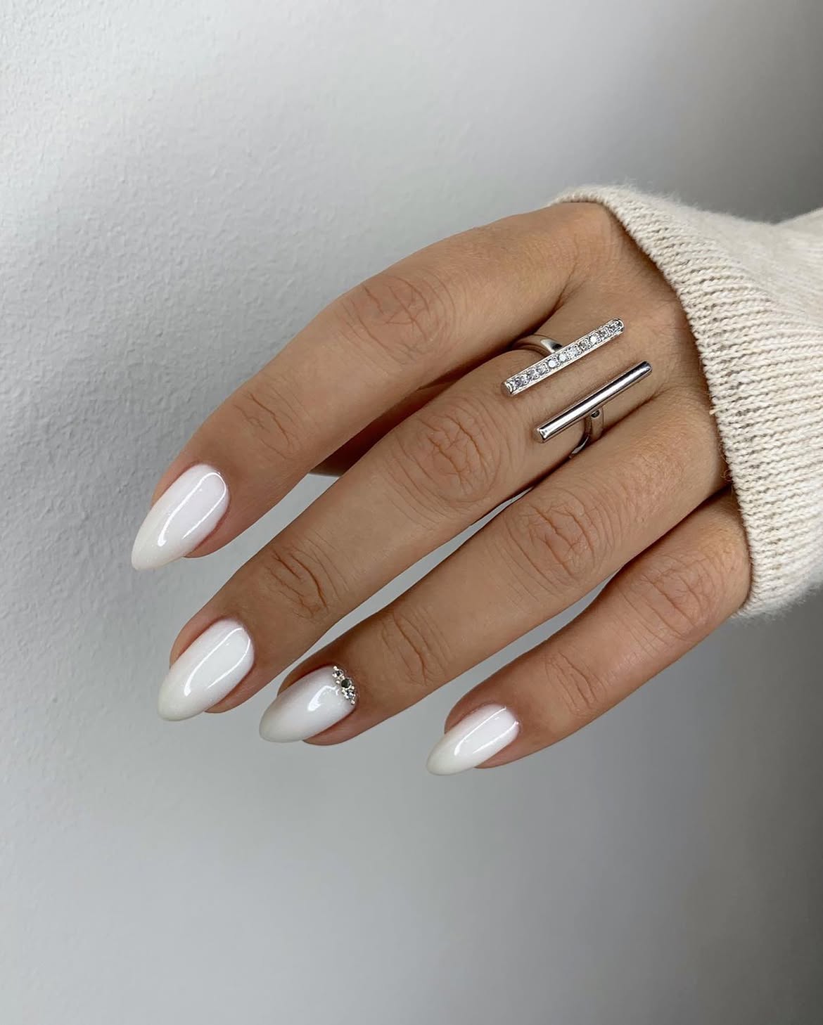 Milky White Almond Nails With Subtle Sparkle