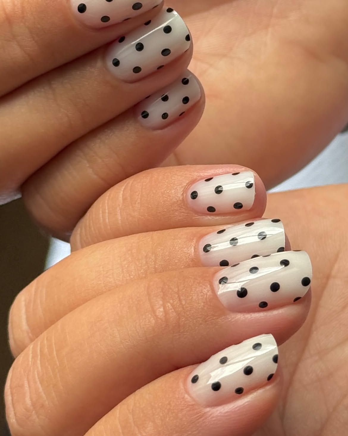 Milky White Nails with Classic Black Polka Dots