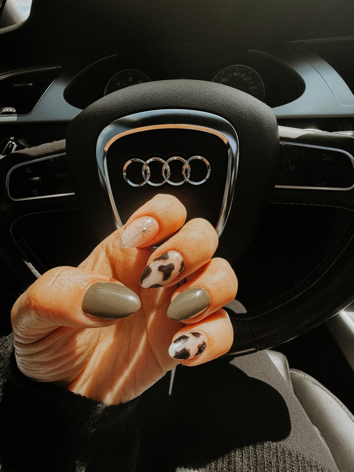 Mismatched Cow Print and Olive Green Almond Nails