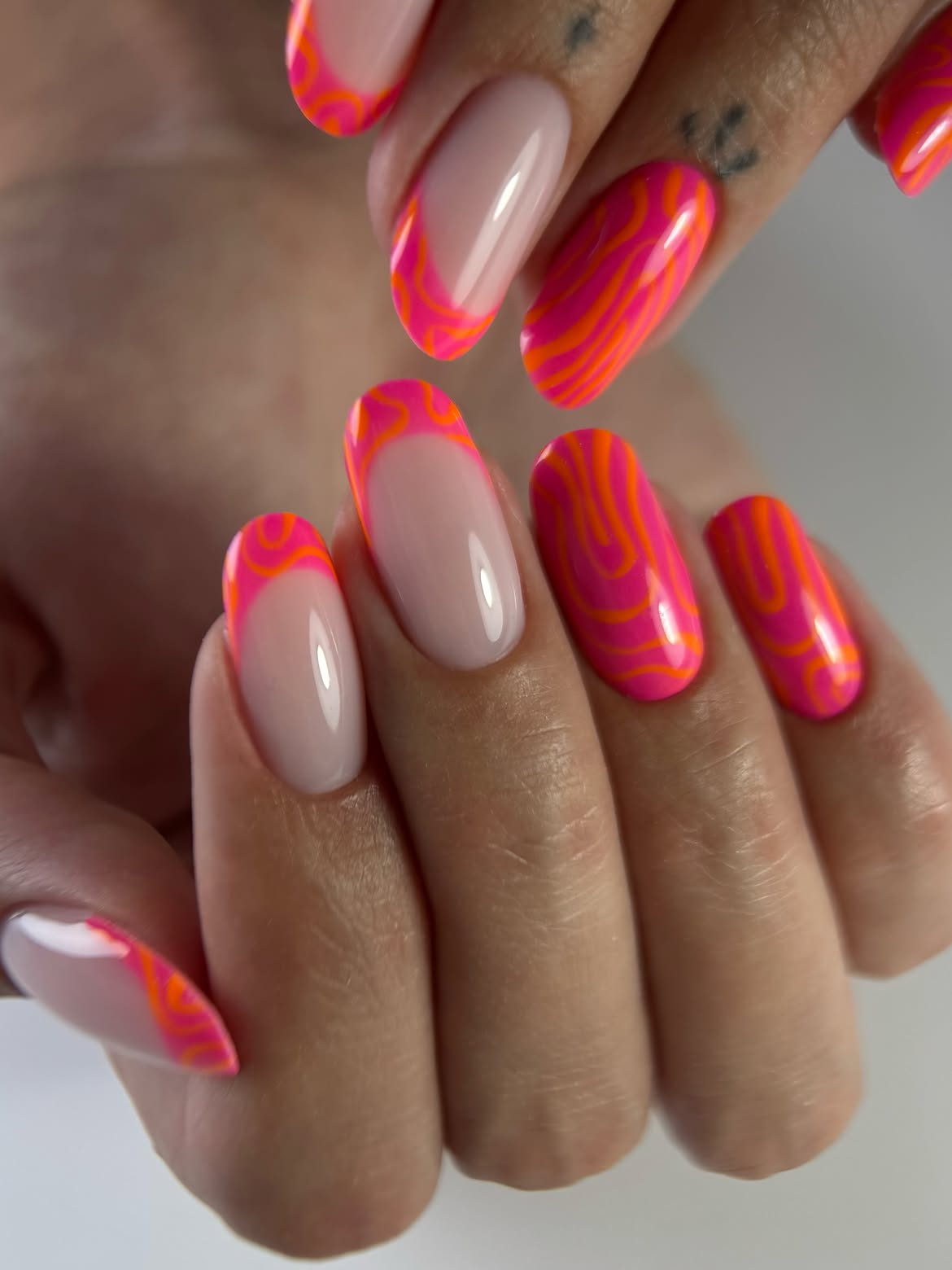 Pink and Orange Swirl French Tip Almond Nails