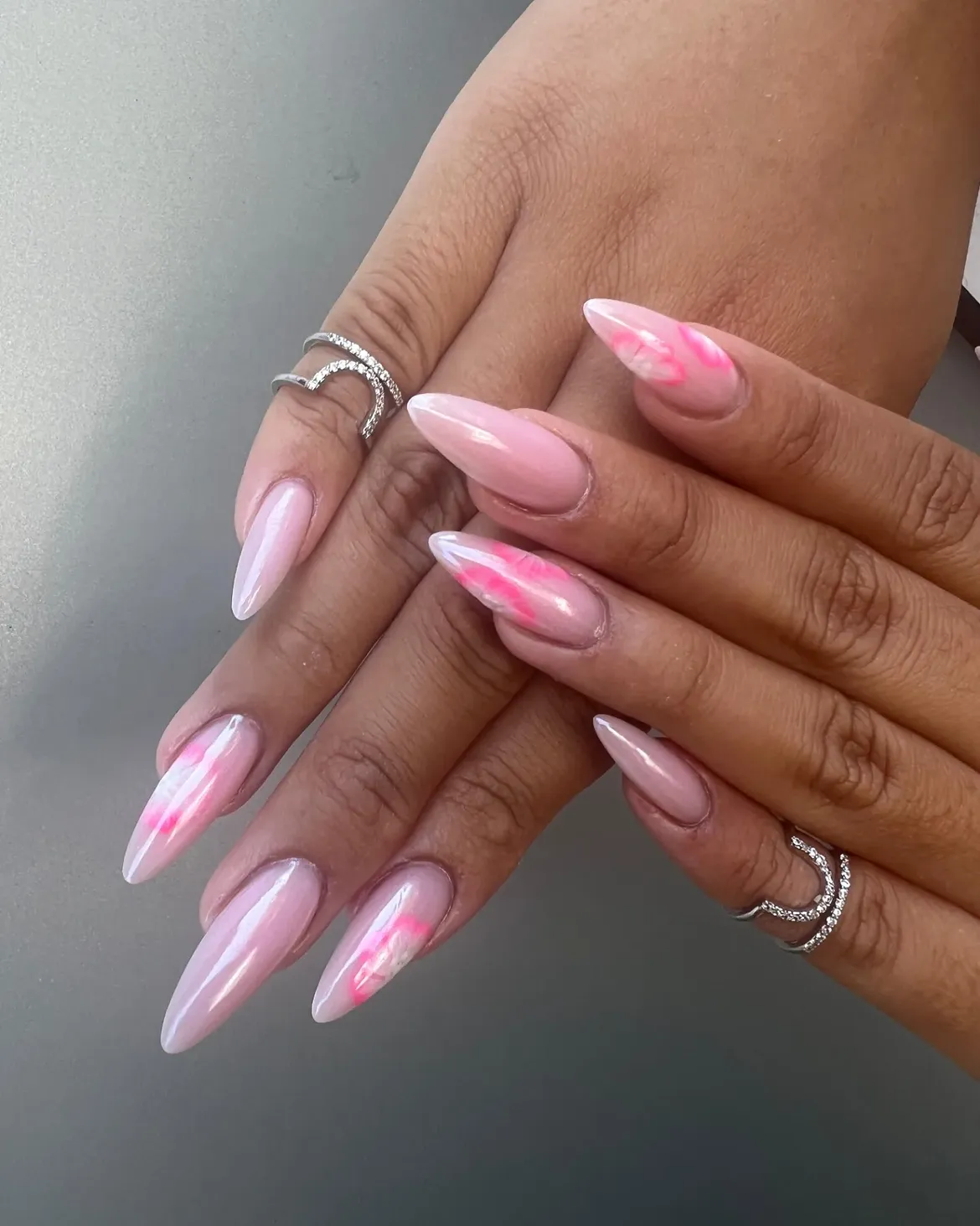 Pink Marble Stiletto Nails with Pearlescent Sheen