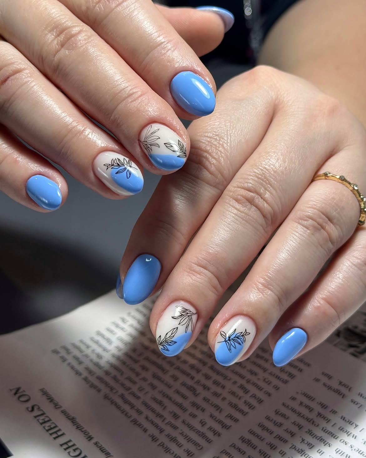Sky Blue Oval Nails with Delicate Leaf Art