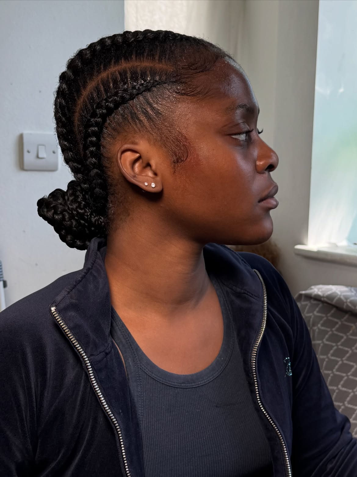 Sleek Cornrow Braids to a Low Bun