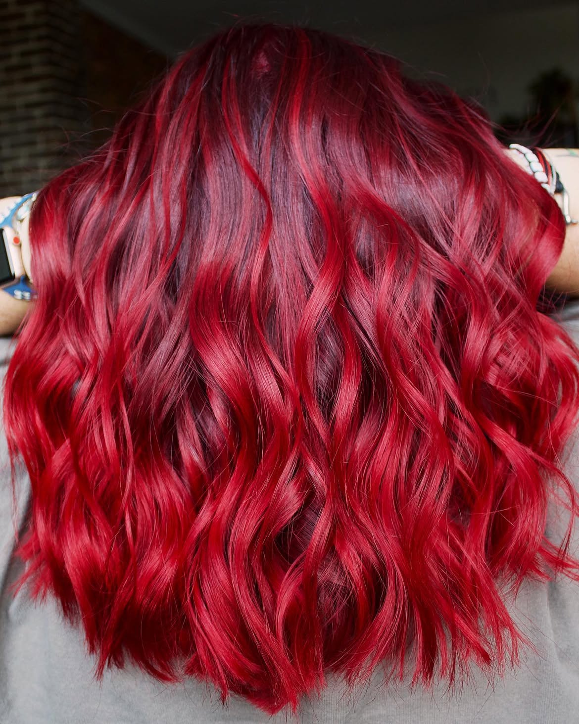 Vibrant Cherry Red Waves With Dark Roots