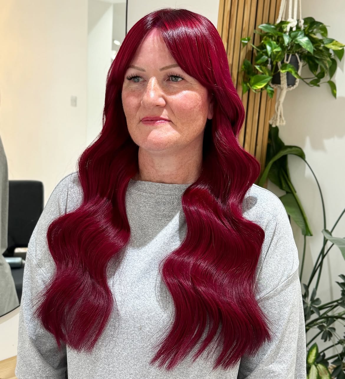 Vibrant Cherry Red Waves With Face Framing Bangs