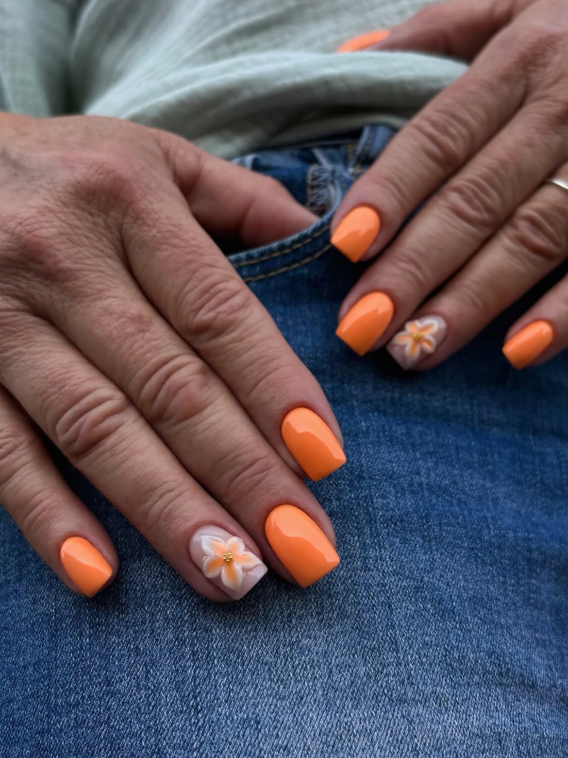 Vibrant Orange Coffin Nails with 3D Floral Accent