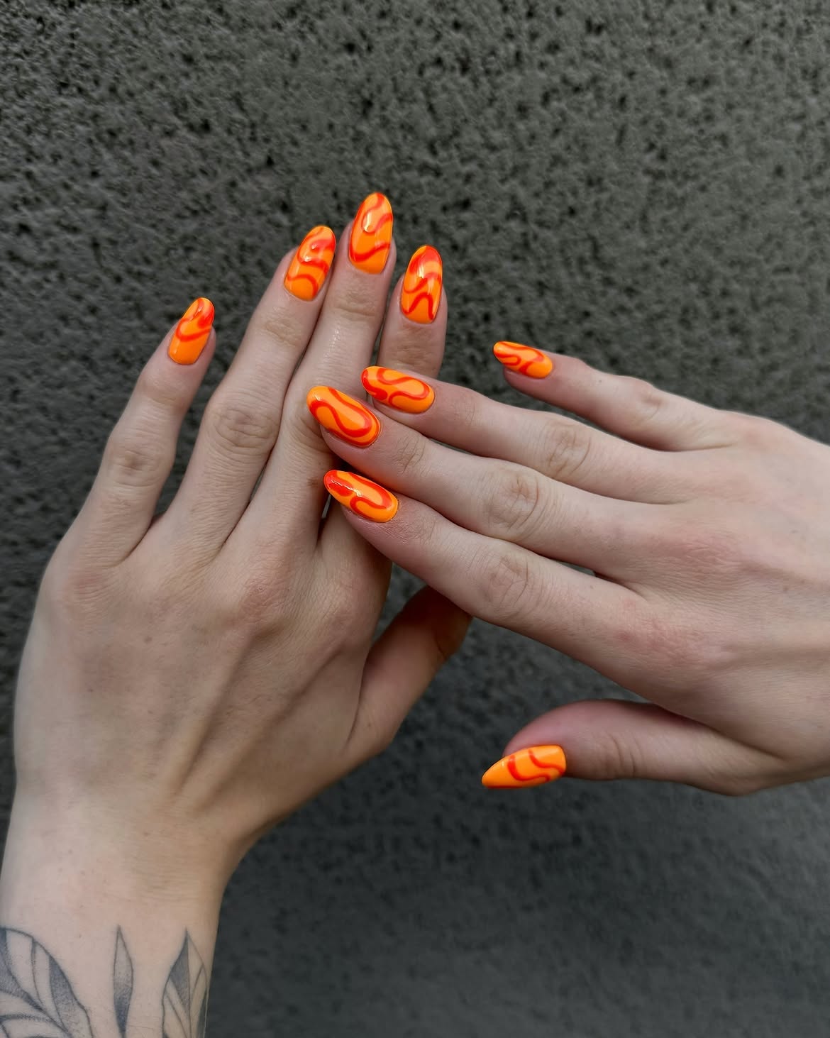 Vibrant Orange Flame Swirl Almond Nails