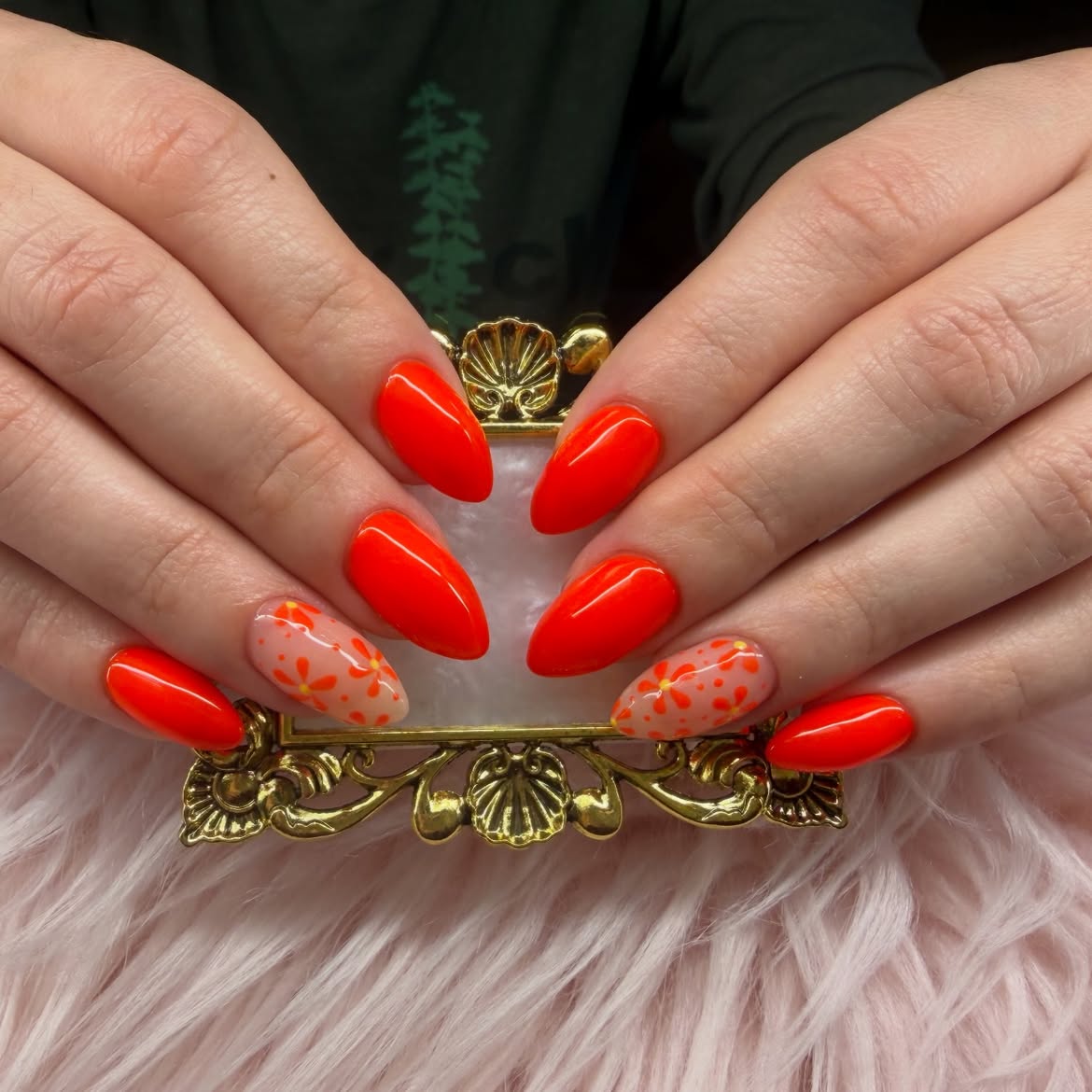 Vibrant Orange Floral Accented Almond Nails