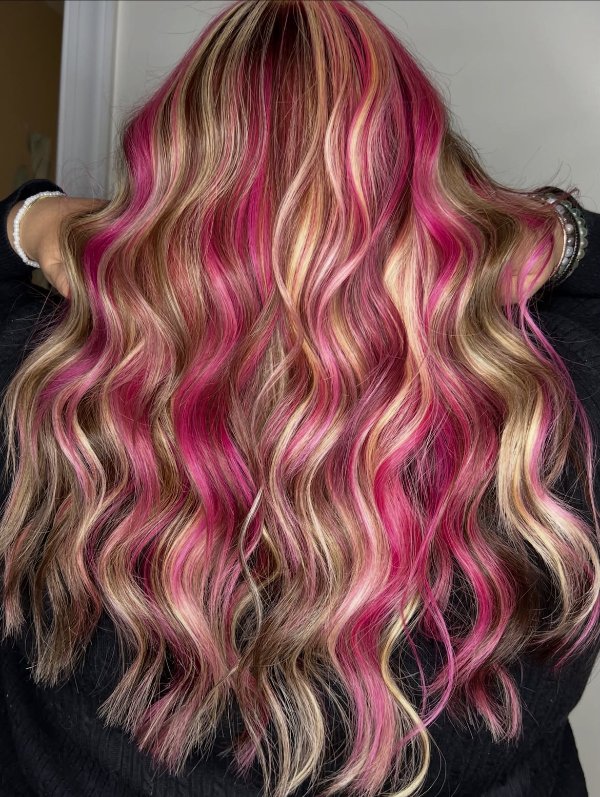 Vibrant Pink Streaks On Honey Blonde Waves