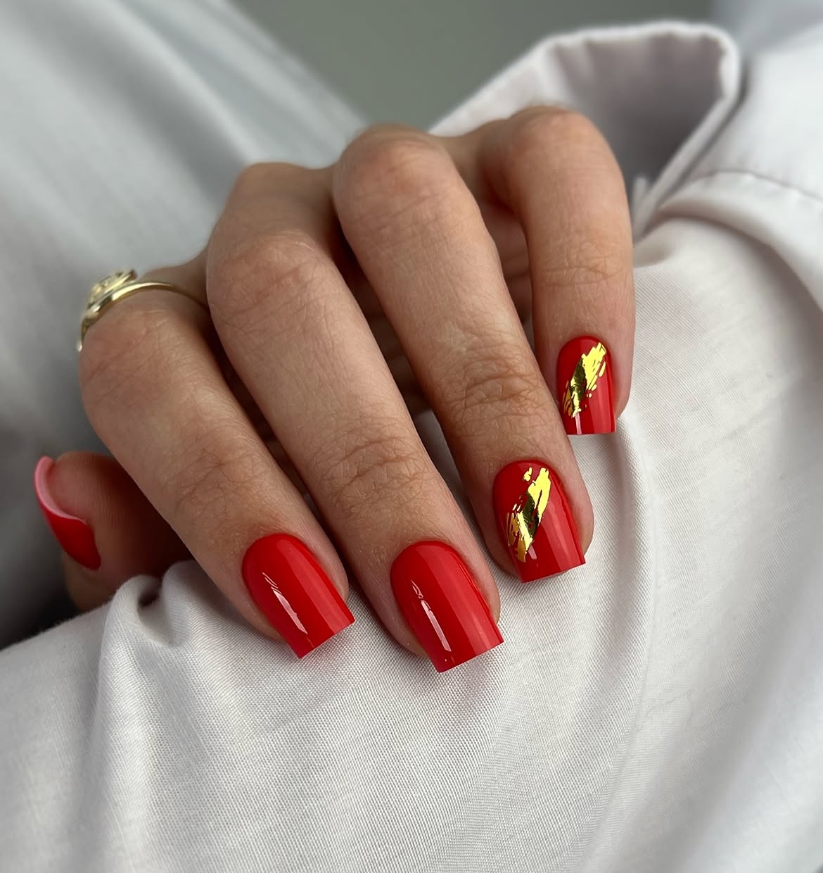 Vibrant Red Square Nails With Gold Foil Accents