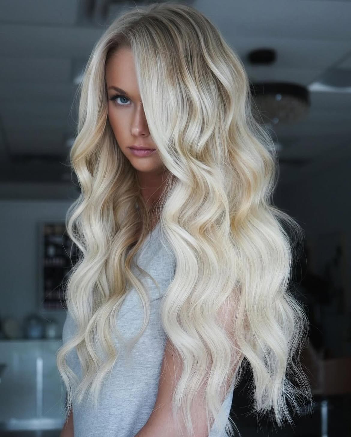 Voluminous Blonde Waves With Curtain Bangs