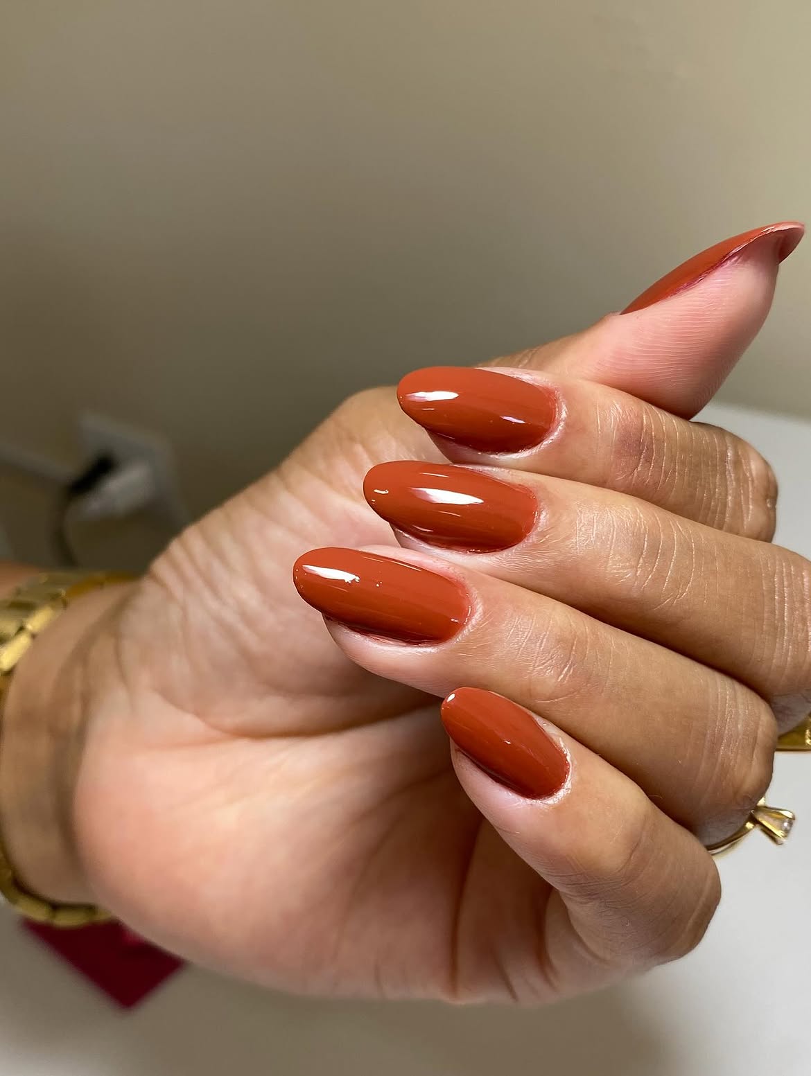 Warm Rust Orange Glossy Almond Nails