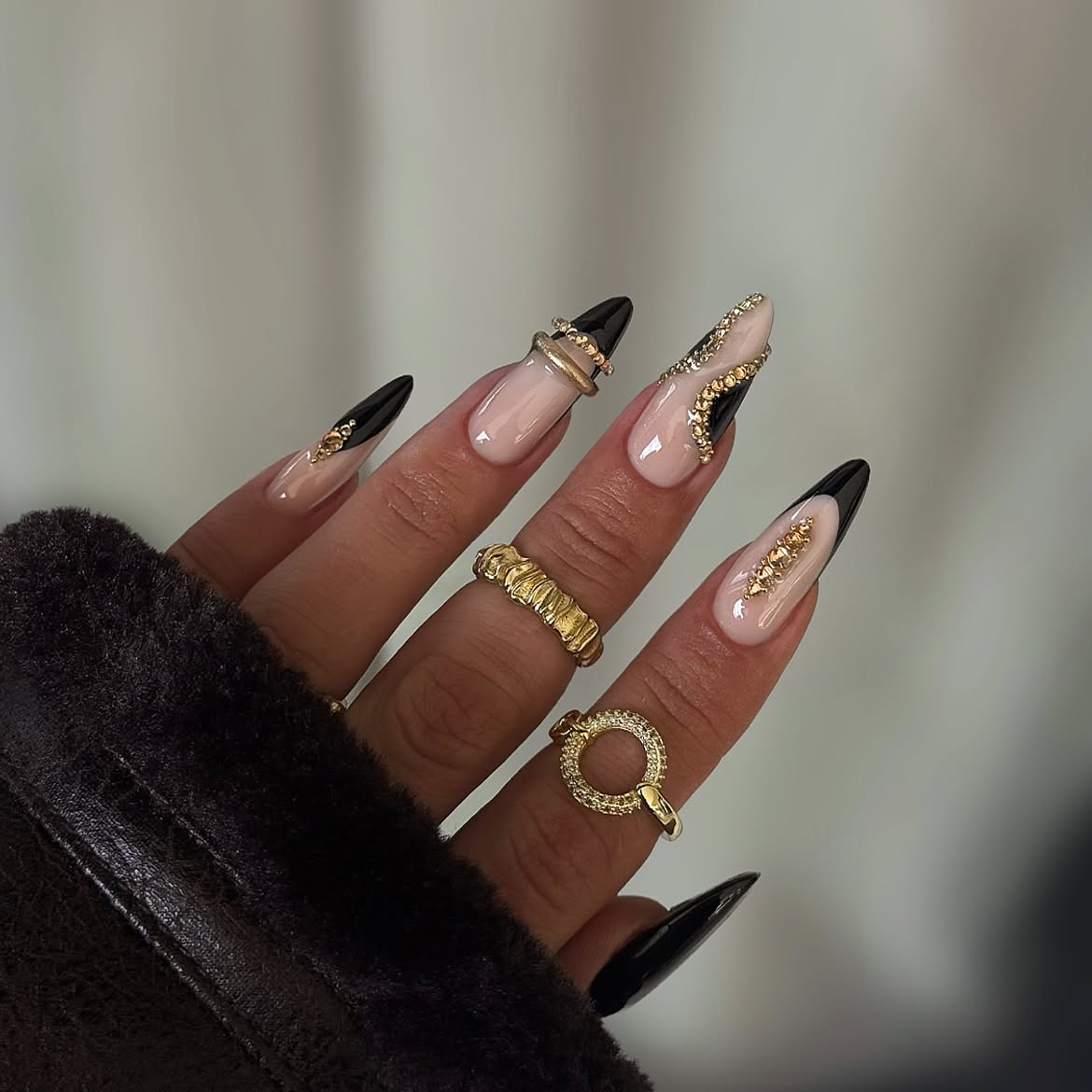 Black and Nude Glam Stiletto Nails with Gold Accents