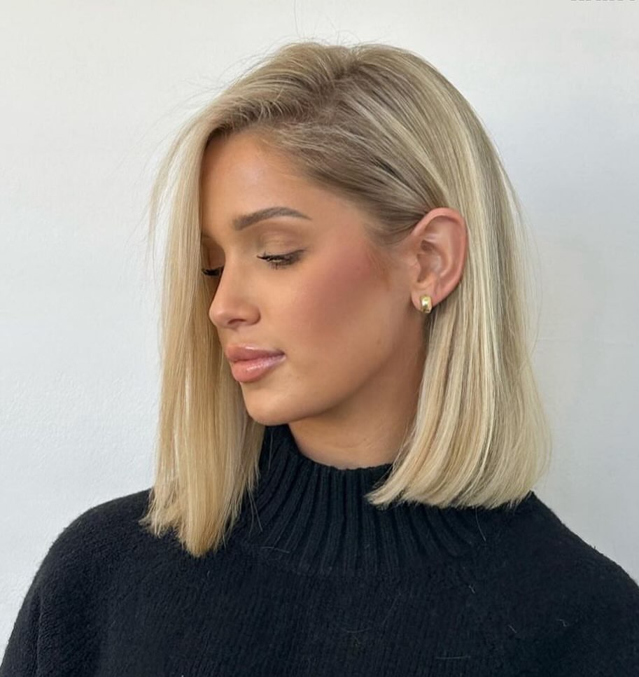 Blonde Bob With Face Framing Layers and Deep Side Part